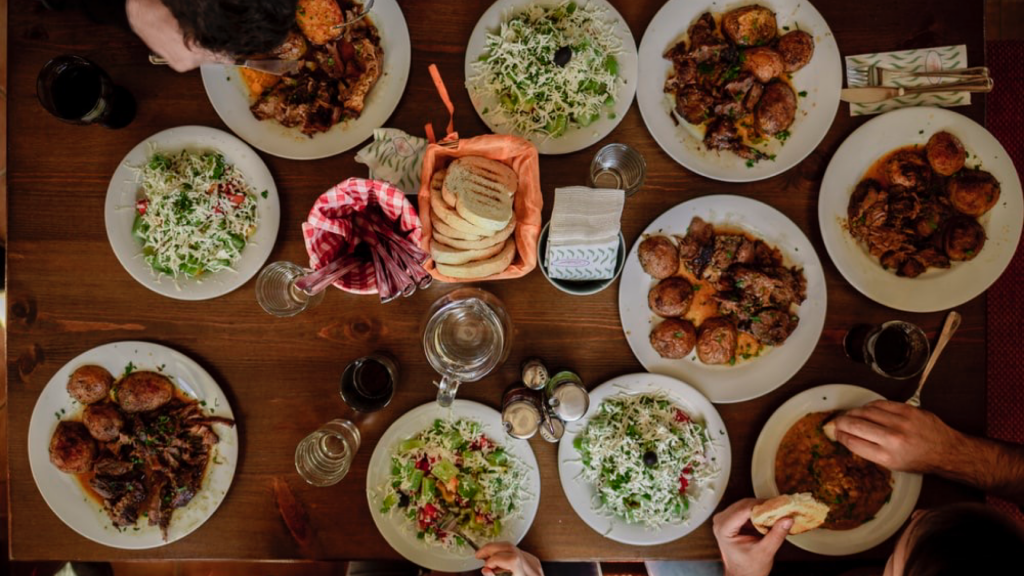 A variety of plates of food on a table