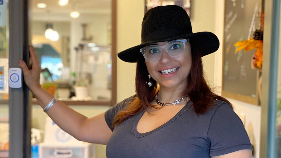 Mint Salon and Spa owner Lisabella Ibarra standing in the doorway of her business.